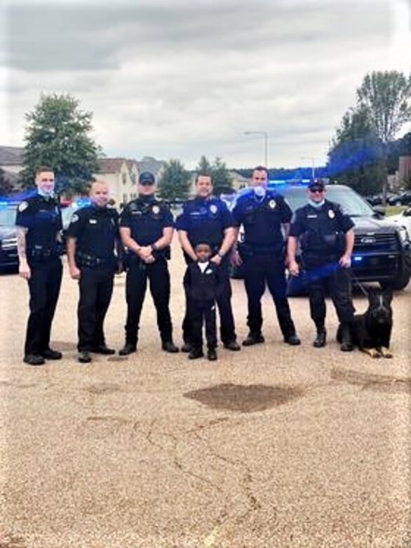 IN THE PHOTO, Bartlett police officers made a surprise visit to Contract Specialist Sequoria Wilson’s son’s birthday party, at her request, earlier this month. “They gave out goody bags to all the kids, took my son on a ride around the block, and took pictures," Wilson said. "The goody bags had masks, a BPD coin, coloring book, candy, toy shields, and more." (Courtesy photo)