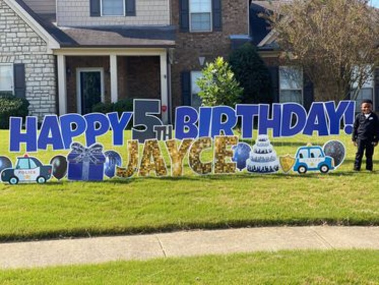 IN THE PHOTO, Bartlett police officers made a surprise visit to Contract Specialist Sequoria Wilson’s son’s birthday party, at her request, earlier this month. “They gave out goody bags to all the kids, took my son on a ride around the block, and took pictures," Wilson said. "The goody bags had masks, a BPD coin, coloring book, candy, toy shields, and more." (Courtesy photo)