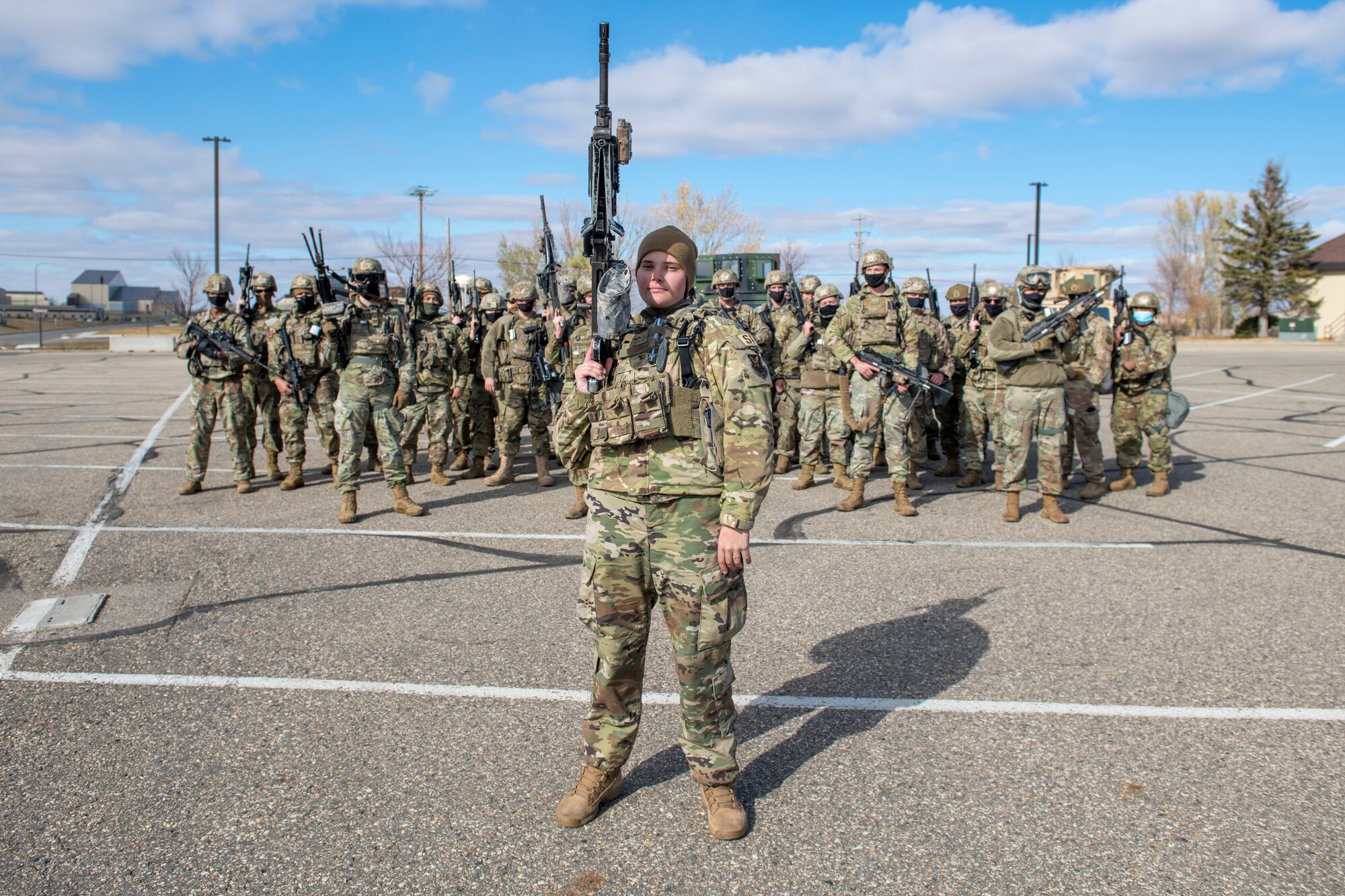 Airman 1st Class Lauryn Reabold, 5th Security Forces Squadron defender, poses for a portrait on Oct. 19, 2020 at Minot Air Force Base, North Dakota. Reabold operates the .240 Echo machine gun out of the Humvee turret on the lead convoy as she and her fellow defenders scout the road and inestigate the avenues of appoach. (U.S. Air Force photo by Airman 1st Class Josh W. Strickland)