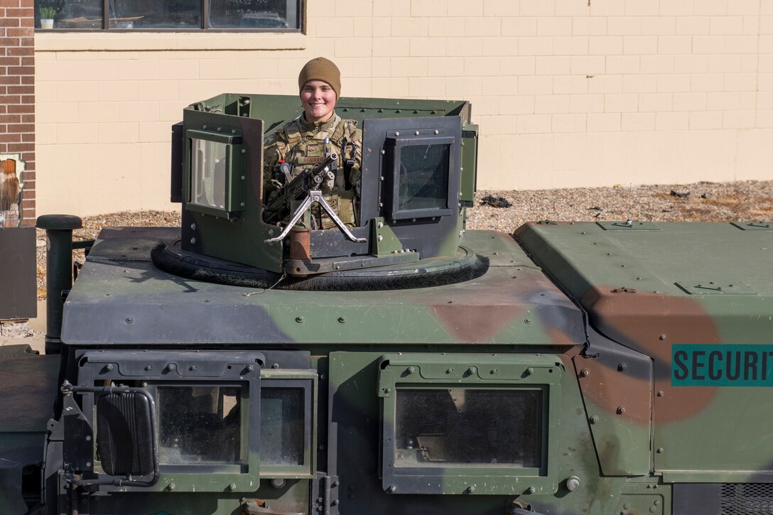 Airman 1st Class Lauryn Reabold, 5th Security Forces Squadron defender, poses for a portrait on Oct. 19, 2020 at Minot Air Force Base, North Dakota. Reabold operates the .240 Echo machine gun out of the Humvee turret on the lead convoy as she and her fellow defenders scout the road and inestigate the avenues of appoach. (U.S. Air Force photo by Airman 1st Class Josh W. Strickland)