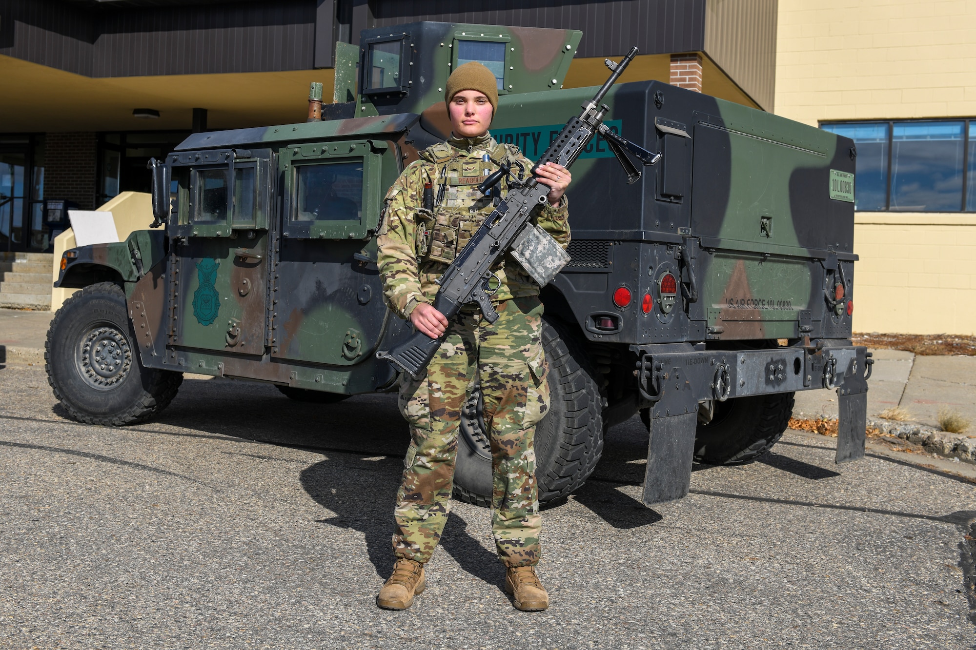 Airman 1st Class Lauryn Reabold, 5th Security Forces Squadron defender, poses for a portrait on Oct. 19, 2020 at Minot Air Force Base, North Dakota. Reabold operates the .240 Echo machine gun out of the Humvee turret on the lead convoy as she and her fellow defenders scout the road and inestigate the avenues of appoach. (U.S. Air Force photo by Airman 1st Class Josh W. Strickland)