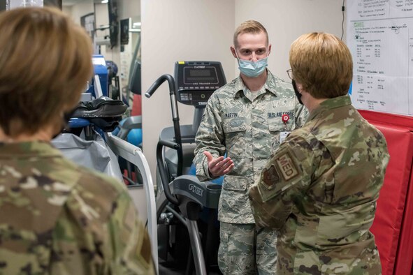 Lt. Gen. Dorothy Hogg (right), U.S. Air Force Surgeon General, and Chief Master Sgt. Dawn Kolczynski (left), Medical Enlisted Force chief, are briefed by Senior Airman Heath Martin, 22nd Operational Medical Readiness Squadron physical medicine technician, on the uses of the Anti-Gravity treadmill located in the 22nd Medical Group physical therapy clinic Oct. 15, 2020, at McConnell Air Force Base, Kansas. During the visit, Hogg toured the 22nd Medical Group facilities and connected with Team McConnell Airmen about their contribution to the 22nd ARW’s global mobility mission. (U.S. Air Force photo by Senior Airman Skyler Combs)