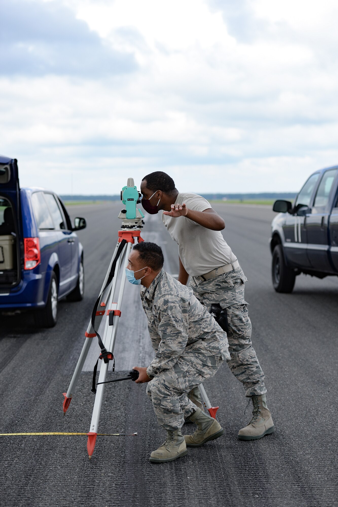 A photo of 1st Lt. Bernard Cortes and Tech. Sgt. Delvin S. Reneau using a Nikon NPL-322+ P Series Total Station.
