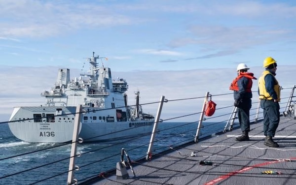 (Sept. 9, 2020) Sailors assigned to the Arleigh Burke-class guided-missile destroyer USS Ross (DDG 71) approach the British Royal Fleet Auxiliary tanker RFA Tidespring (A136) for a replenishment-at-sea in the Barents Sea, Sept. 9, 2020. Ross is conducting maritime security operations in the Barents Sea as part of a Surface Action Group with the Royal Navy and Royal Norwegian Navy. (U.S. Navy photo by Mass Communication Specialist Seaman Christine Montgomery)