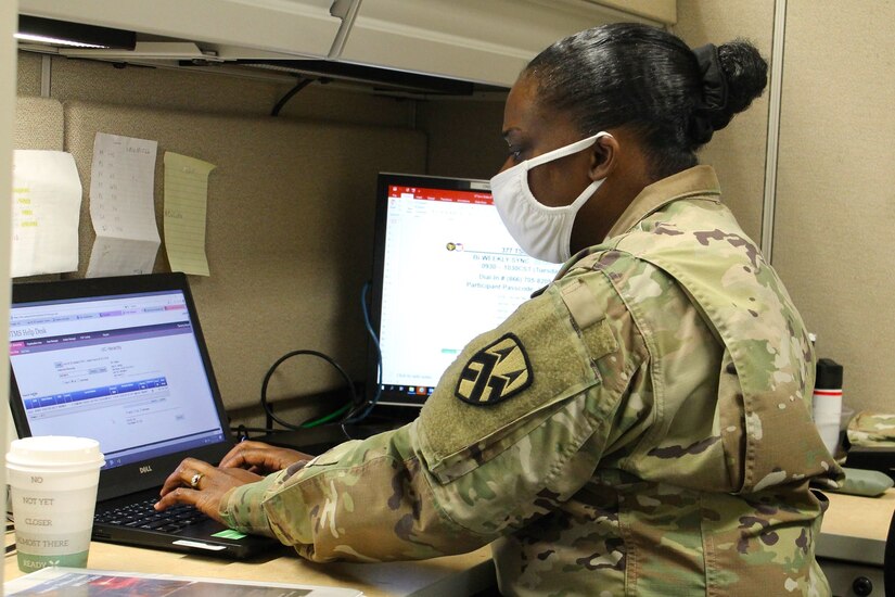 Sgt. First Class Tamarra Ntambi, the schools and individual training non-commissioned officer at the 377th Theater Sustainment Command, processes Soldiers for military schools at the headquarters building in Belle Chasse, La., Oct. 20, 2020.