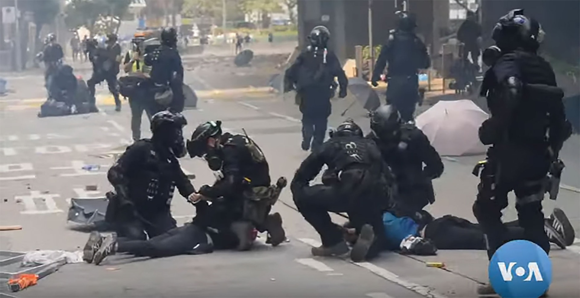 Police seemingly indiscriminately arrested protestors in Hong Kong on riot related charges. (Bill Gallo, VOA News, 18
November 2019)