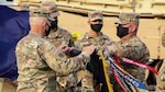 Lt. Col. Rodney Seaba, left, commander of the Kansas Army National Guard’s 2nd Combined Arms Battalion, 137th Infantry Regiment, and Command Sgt. Maj. Paul Purdham, right, case the regimental colors of the Kansas Army National Guard’s 2nd CAB, 137th Infantry Regiment Oct. 17. The ceremony was held to redesignate the 2nd CAB, 137th Infantry Regiment, “First Kansas,” as the 1st Battalion, 635th Armor Regiment, in accordance with a 2012 Army chief of staff directive.