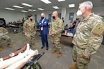 Thomas McCaffery, Assistant Secretary of Defense for Health Affairs, has his temperature checked while entering Willis Hall on his visit to the U.S. Army Medical Center of Excellence at Joint Base San Antonio-Fort Sam Houston Oct. 19.