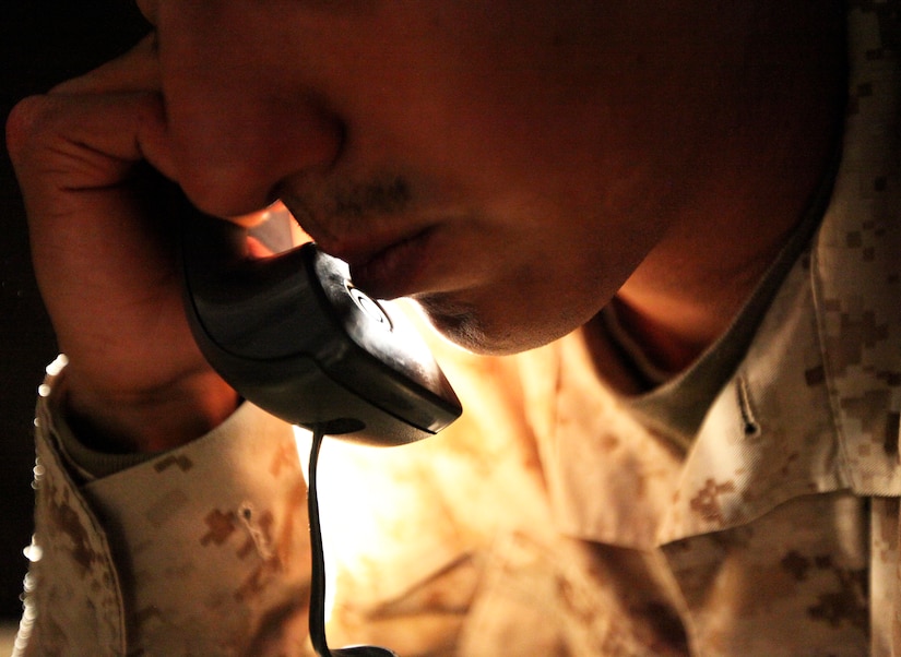 A Marine talks on the phone.