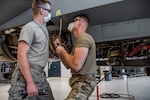 U.S. Air Force Airman 1st Class Matt Wessels and Senior Airman Mai Carson, phase dock crew chiefs assigned to the 140th Maintenance Group, Colorado Air National Guard, remove bolts on a 446 bulkhead during a 300 hour phase inspection at Buckley Air Force Base, Colo., Sep. 13, 2020. F-16 phase inspections are not only vital to the mainenance of the jet but also for the developent of the various maintainers that are invloved, whether that be anyone from phase crew, weapons to fuels. (U.S. Air National Guard photo by Tech. Sgt. Michelle Alvarez)