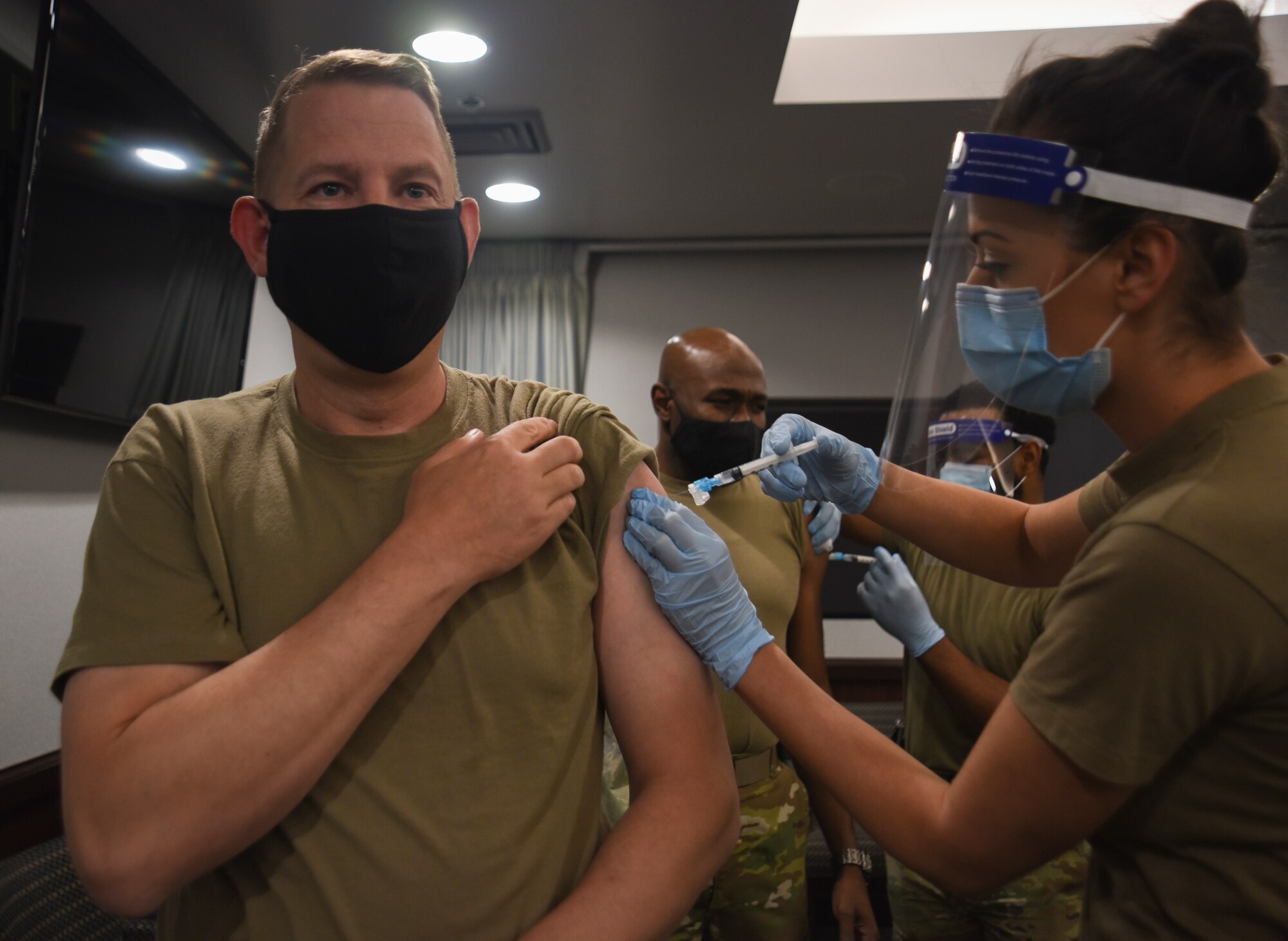 Commander getting flu shot.