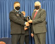 Sgt. Joshua Roth receives the Governor’s Medal from the 57th Governor of Missouri, Mike Parson.