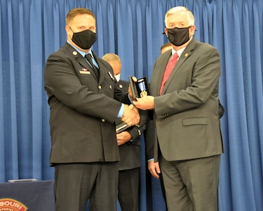 Sgt. Joshua Roth receives the Governor’s Medal from the 57th Governor of Missouri, Mike Parson.