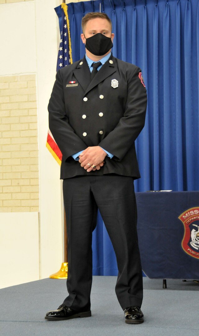 Sgt. Joshua Roth receives the Governor’s Medal from the 57th Governor of Missouri, Mike Parson. Roth, a sergeant in the Missouri National Guard, received the award for actions he took to save the life of a small child while on duty as a firefighter and Emergency Medical Technician in August of 2019.