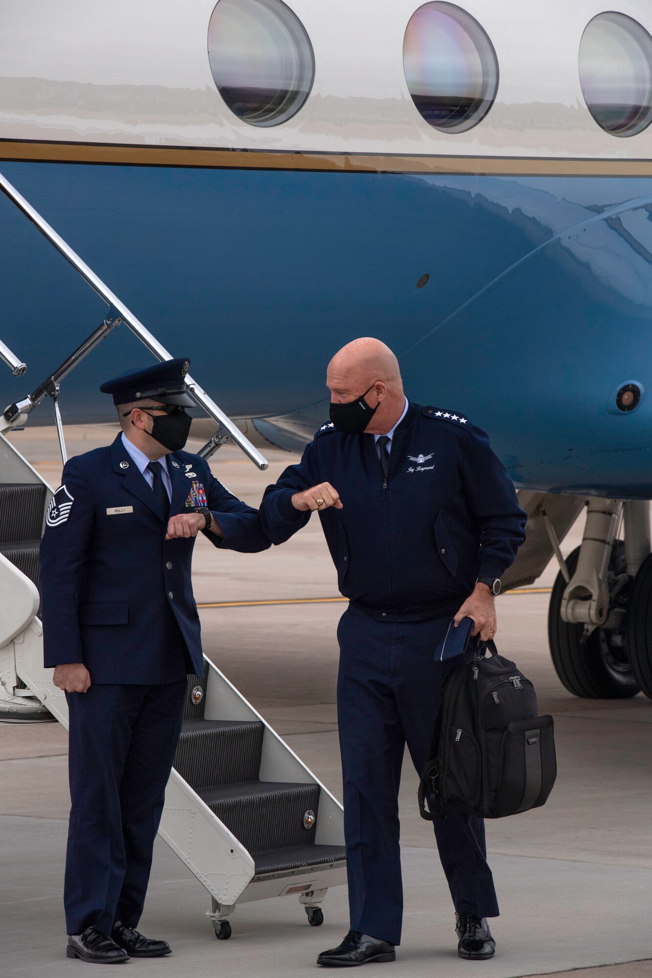Gen. Raymond walks onto the Peterson flightline during a visit
