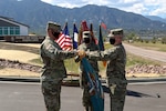 Army Col. Mike Hatfield, the commander of the 100th Missile Defense Brigade, right, and Lt. Col. Michael Lane, the commander of the 117th Space Battalion, unfurl the colors of the 117th Space Battalion during a ceremony at Fort Carson, Colorado, to signify a command relationship change as the 117th is now assigned to the 100th for administrative and operational command and control. This change is part of a larger Colorado Army National Guard realignment to optimize the mission. (Photo by U.S. Army National Guard Staff Sgt. Zach Sheely, 100th Missile Defense Brigade Public Affairs Office)