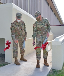 In honor of National Disability Employment Awareness Month, or NDEAM, the U.S. Army Medical Center of Excellence command team of Maj. Gen. Dennis LeMaster and Command Sgt. Maj. Clark Charpentier hosted a small-ribbon cutting setting Oct. 16 for the organization’s newly installed ADA compliant ramp that ensures better accessibility to and from the command headquarters building and Willis Hall at Joint Base San Antonio-Fort Sam Houston.
