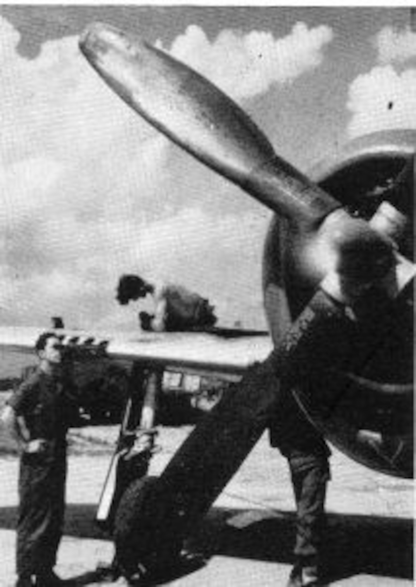 Armorers “boresight” the .50 caliber machine guns in the right wing of a 371st Fighter Group P-47 Thunderbolt fighter plane.  (The Story of the 371st Fighter Group in the E.T.O.)