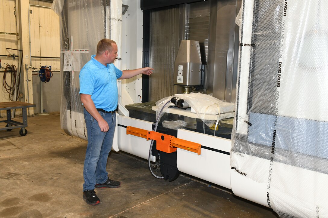 Man standing with machine