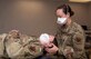 An Airman performs manual cervical traction.