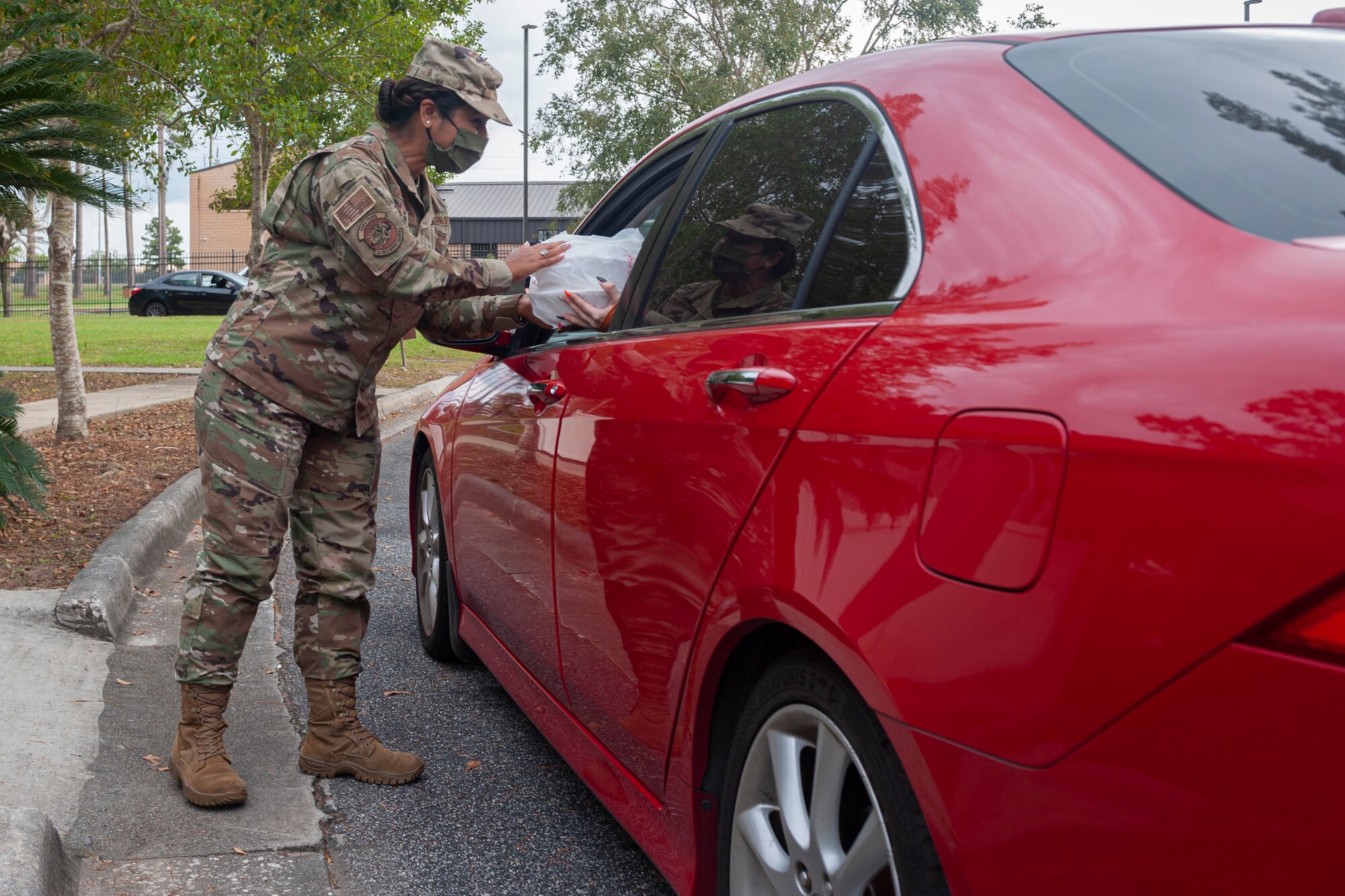 Photo of an Airman serving meals
