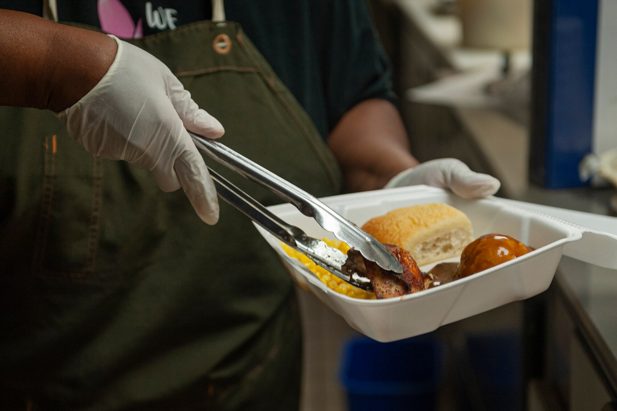 Photo of an Airman preparing a meal