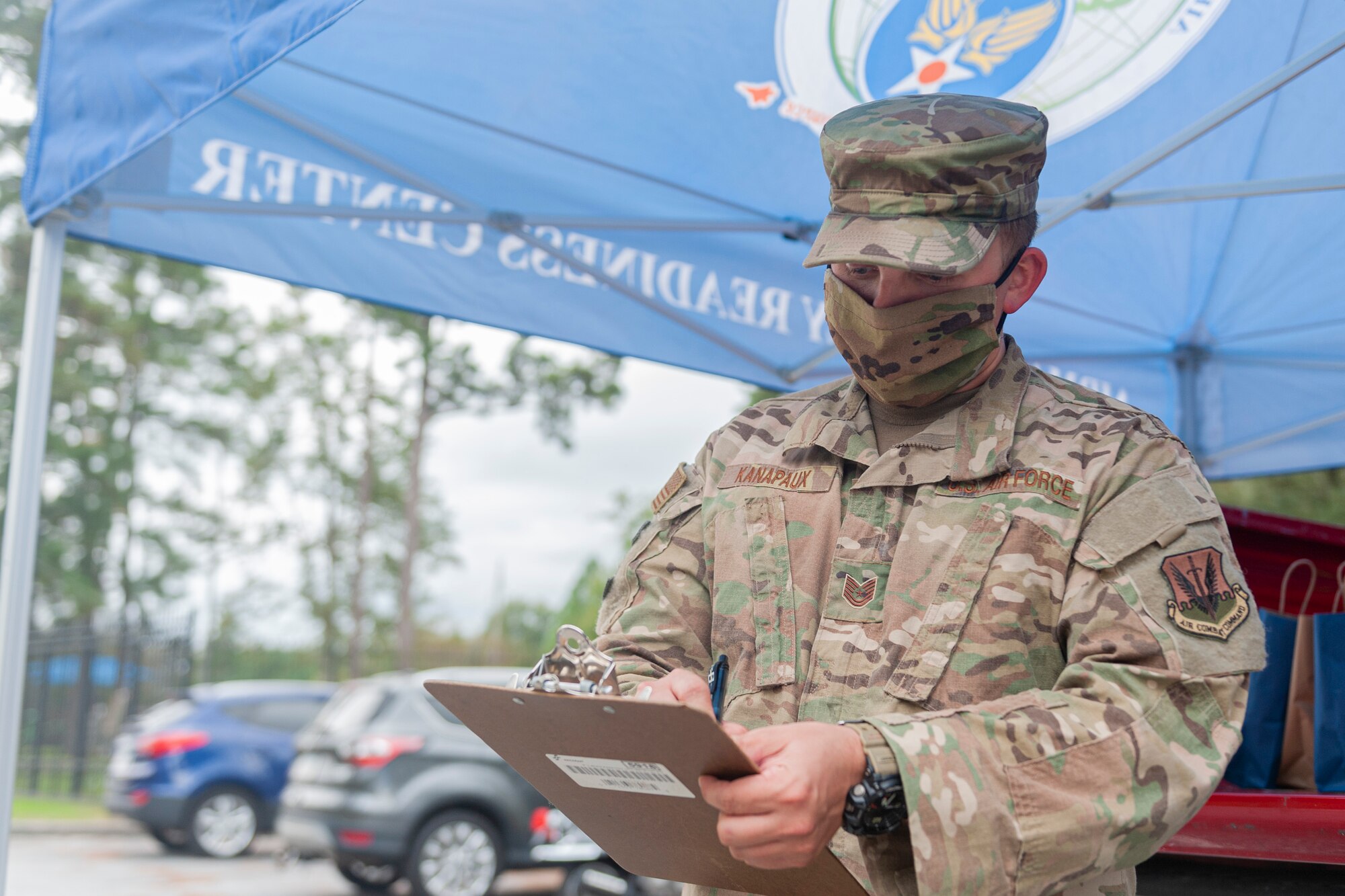 Photo of an airman checking a roster