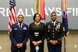 From Left, U.S. Air Force Tech. Sgt. Eldridge Rouse, Evelyn Rouse and U.S. Army 1st Sgt. Tyris Rouse stand together to take a family photo at U.S. Army Central headquarters on Shaw Air Force Base, S.C., Oct. 7, 2020. The Rouse family came together to attend Tyris' retirement ceremony which turned out to be a surprise reunion for Eldridge and the family. (U.S. Army photo by Pfc. Keon Horton)