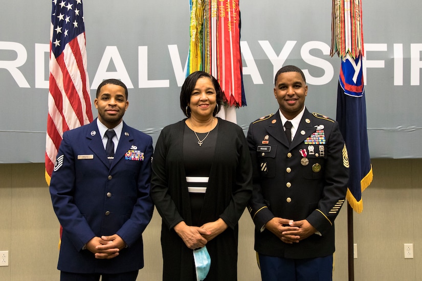 From Left, U.S. Air Force Tech. Sgt. Eldridge Rouse, Evelyn Rouse and U.S. Army 1st Sgt. Tyris Rouse stand together to take a family photo at U.S. Army Central headquarters on Shaw Air Force Base, S.C., Oct. 7, 2020. The Rouse family came together to attend Tyris' retirement ceremony which turned out to be a surprise reunion for Eldridge and the family. (U.S. Army photo by Pfc. Keon Horton)