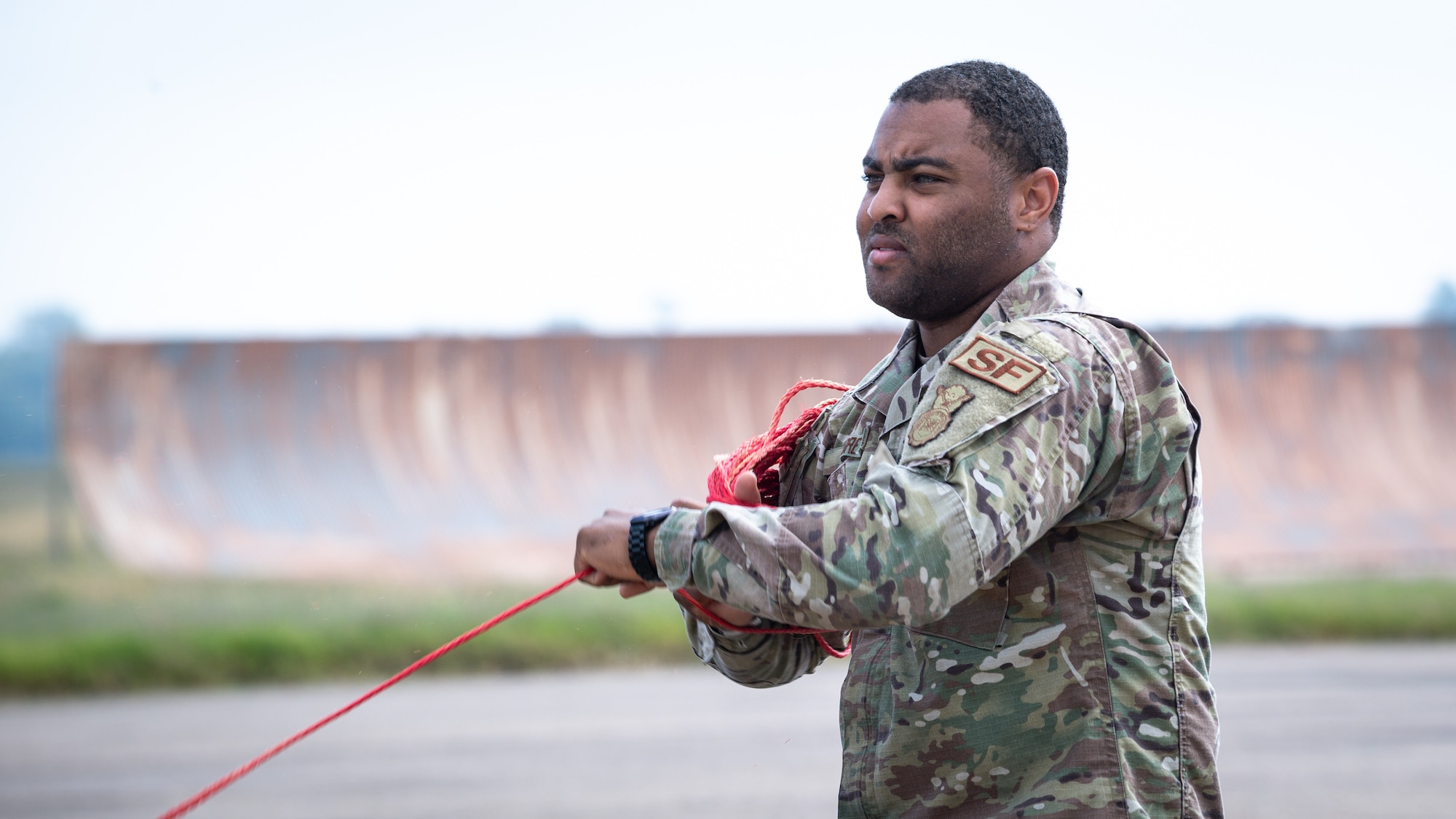 Staff Sgt. Dijon Moore, 2nd Security Forces Squadron vehicle control officer, winds rope while setting up for Global Thunder 21 at Barksdale Air Force Base, La., Oct. 20, 2020.
