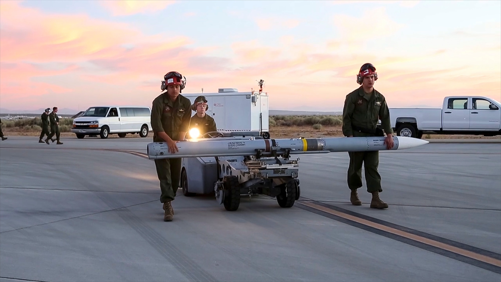 Ground crews prepare an AIM-120 missile for a flight test at Edwards Air Force Base, California, July 10. (Photo courtesy of Lance Cpl. Larisa Chavez, MCAS Yuma)