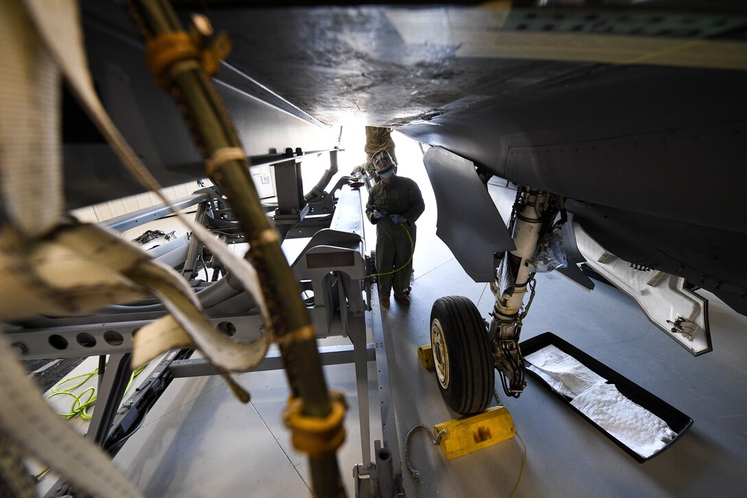 Master Sgt. Andrew Wilkow, 372nd Training Squadron Detachment 3, works a wing reattachment and repair on a repurposed F-35A Lightning II.