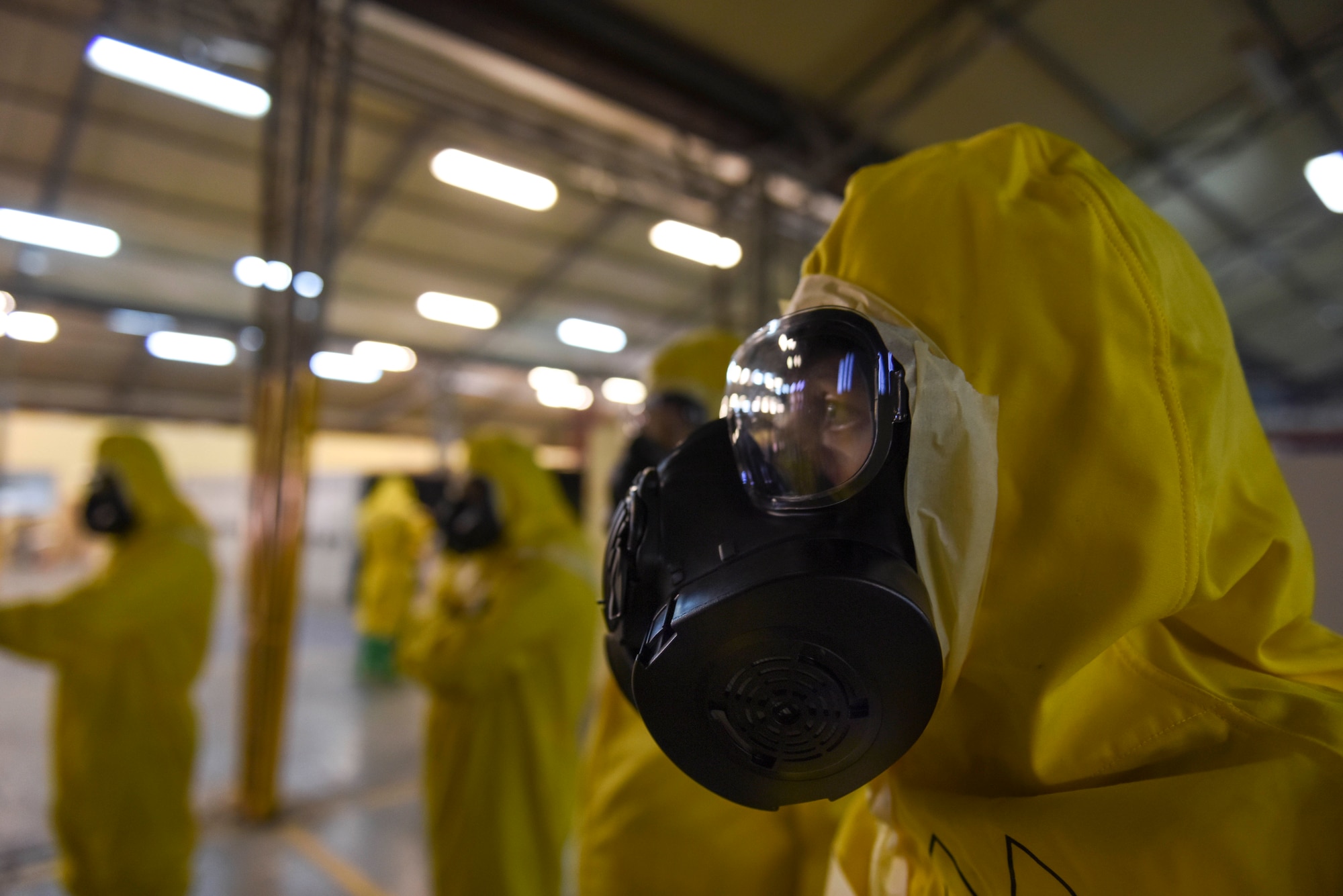 Photo of an Airman listening to an exercise brief
