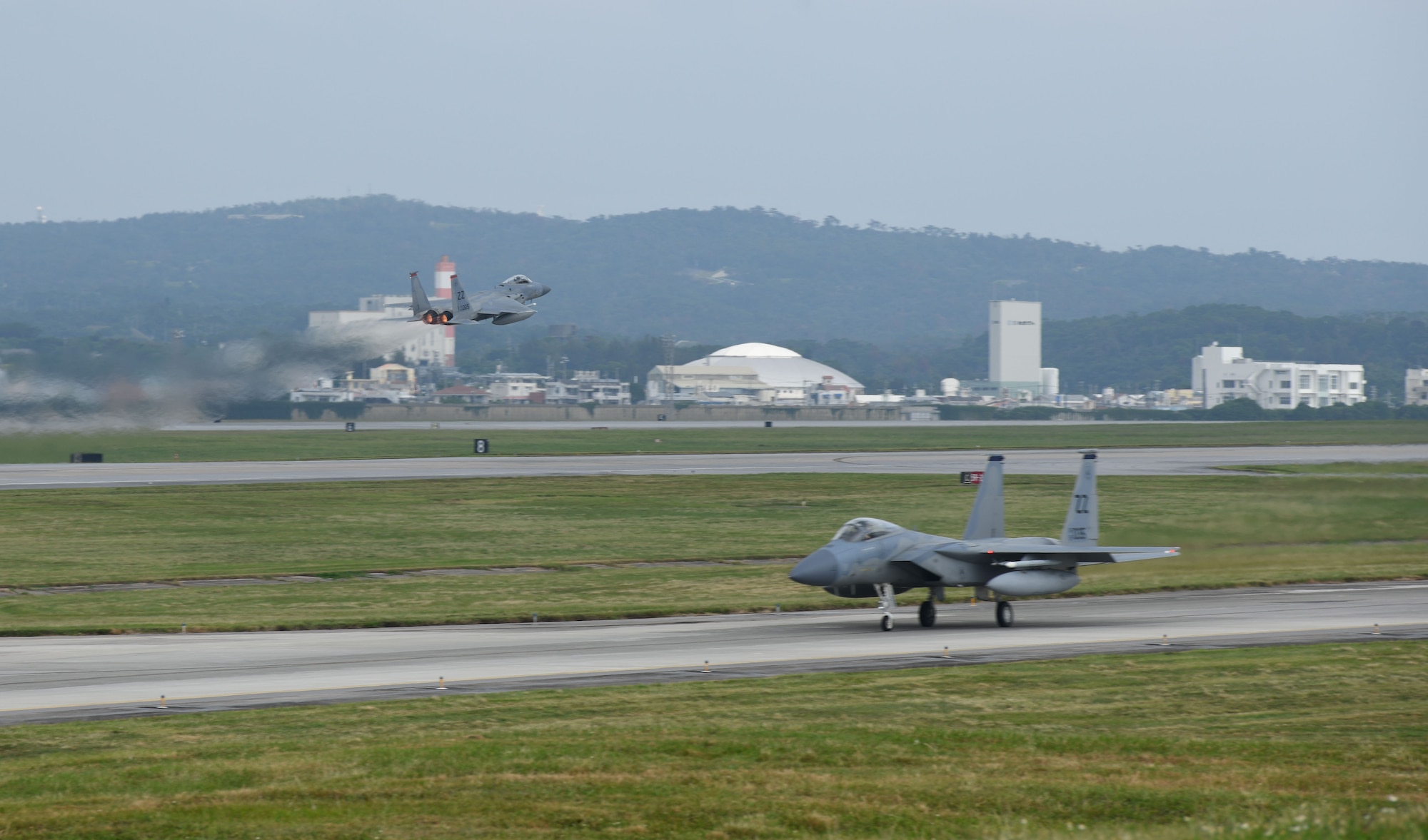 U.S. Air Force F-15C Eagles takeoff from the runway and taxi along the flightline during Exercise WestPac Rumrunner Oct. 16, 2020, at Kadena Air Base, Japan. The 18th Wing must be ready to cooperate with regional partners, ready to compete against peer adversaries, and ready to fight tonight should there be a need to do so. By continuously exercising, the 18th Wing is able to bolster lethality and combined interoperability with partners. Exercises focus on readiness of force and optimize international engagements to build partner capacity. (U.S. Air Force photo by Tech. Sgt. Benjamin Sutton)