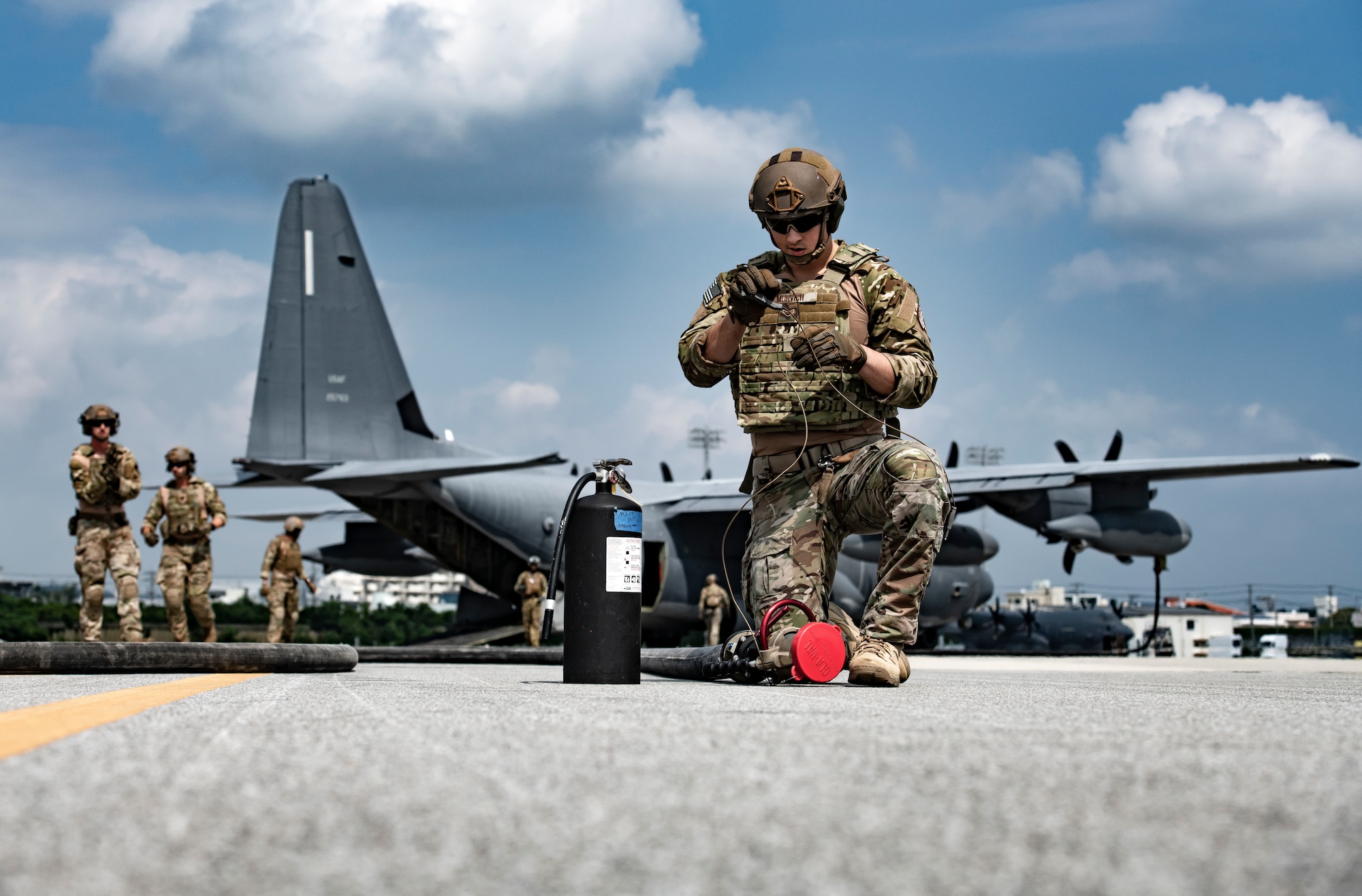 U.S. Air Force Airman 1st Class Joseph Murvich, 18th Logistics Readiness Squadron forward area refueling point team member, prepares a fuel line for use during the third iteration of Exercise WestPac Rumrunner Oct. 16, 2020, at Kadena Air Base, Japan. The name Rumrunner originates from the Prohibition era where brigands would smuggle alcohol across county lines. These events were known as “rum running” and soon became a catchall term adopted by the military to describe a covert, swift strike event; designed to disrupt and disorient the enemy by emerging suddenly and ending the conflict just as quickly. (U.S. Air Force photo by Tech. Sgt. Micaiah Anthony)