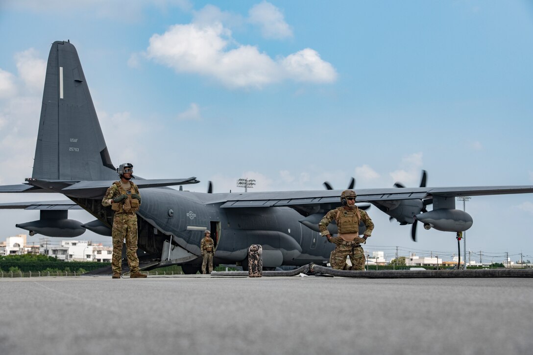U.S. Air Force Airmen from the 353rd Special Operations Group and 18th Logistic Readiness Squadron stand-by during forward area refueling point operations for the third iteration of Exercise WestPac Rumrunner Oct. 16, 2020, at Kadena Air Base, Japan. Exercises that utilize agile combat employment concepts ensure forward-deployed forces in the Indo-Pacific are ready to protect and defend partners, allies and U.S. interests at a moment’s notice. ACE-related activities exemplify the National Defense Strategy by being strategically predictable, but operationally unpredictable. (U.S. Air Force photo by Tech. Sgt. Micaiah Anthony)