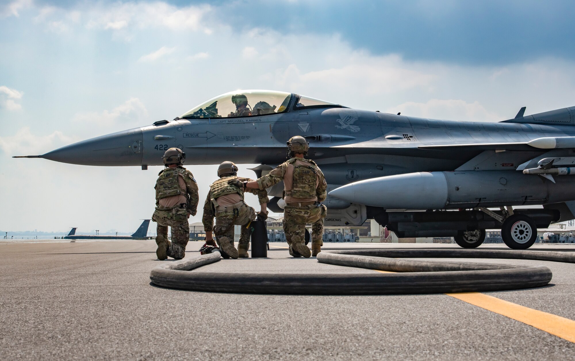 U.S. Air Force forward area refueling point Airmen assigned to the 18th Logistic Readiness Squadron prepare to refuel an F-16 Fighting Falcon during the third iteration of Exercise WestPac Rumrunner Oct. 16, 2020, at Kadena Air Base, Japan. One intent of WestPac Rumrunner is to integrate specific skills Airmen practice regularly into one integrated, joint scenario. The 18th Wing brings a diverse array of capabilities to the table – air superiority, aerial refueling, airborne command and control, combat search and rescue, aeromedical evacuation, special operations, and a variety of combat support services in addition to the contributions of our joint partners. (U.S. Air Force photo by Tech. Sgt. Micaiah Anthony)