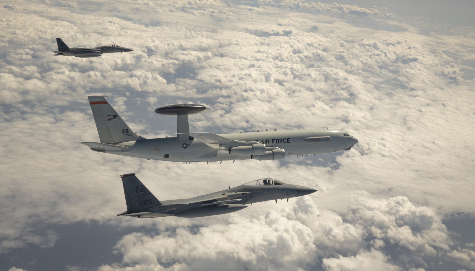 U.S. Air Force F-15C Eagles and an E-3 Sentry aircraft assigned to the 18th Wing fly in formation after participating in Exercise Westpac Rumrunner, out of Kadena Air Base, Japan, Oct. 16, 2020. Taking steps to innovate and integrate during exercises and operations enhances readiness and lethality for the 18th Wing, its allies and partners so the wing is ready to respond quickly. The various efforts undertaken to promote the PACAF mission directly contribute to the ability to strengthen alliances and partnerships with an emphasis on interoperability, domain awareness, information sharing, and disaster response. (U.S. Air Force photo by Tech. Sgt. Daniel E. Fernandez)