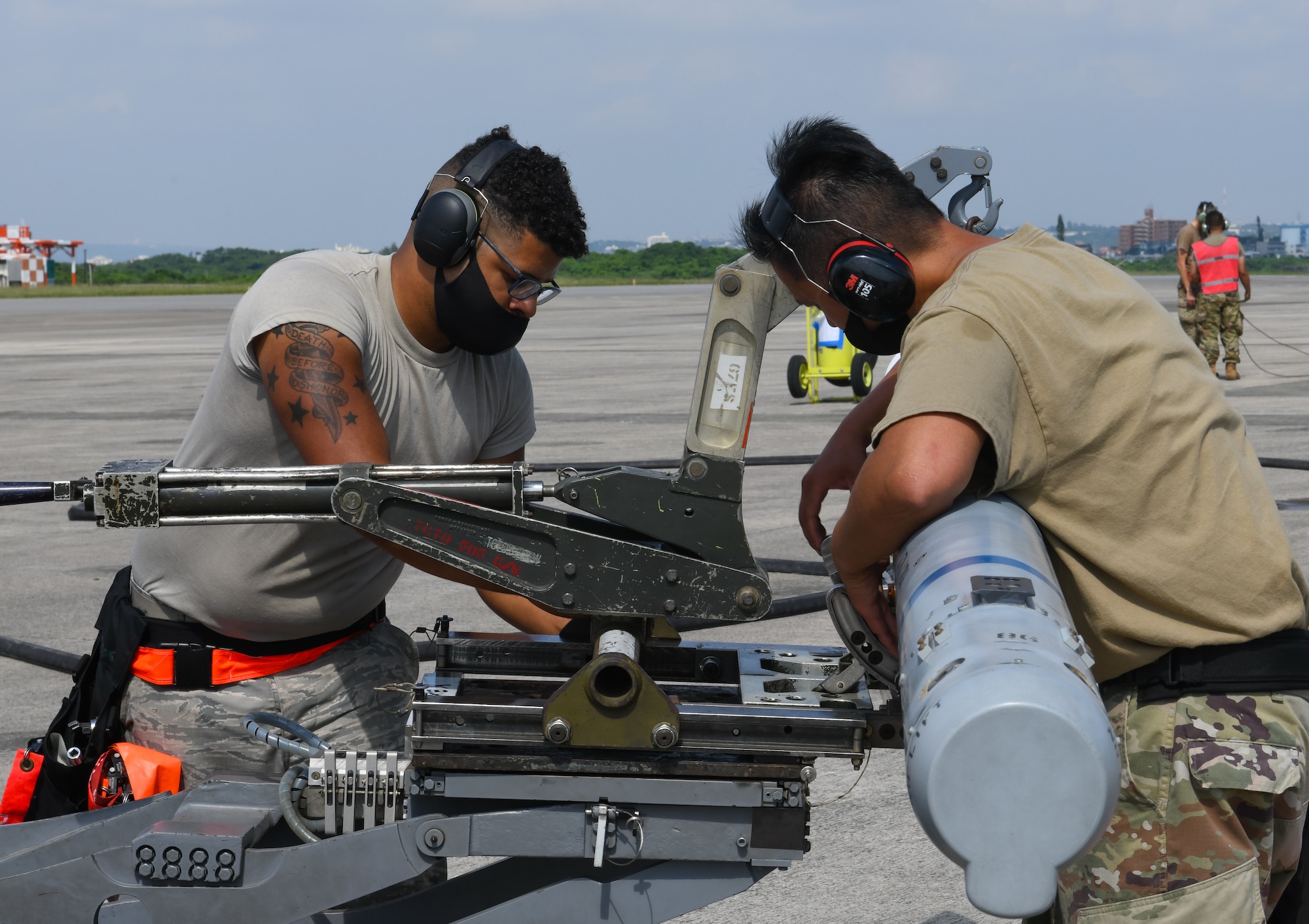 Airmen from the 67th Aircraft Maintenance Unit prepare to reload an F-15C Eagle during Exercise WestPac Rumrunner at Marine Corps Air Station Futenma, Japan, Oct. 16, 2020. The forward air refueling point mission supports contingency and exercise operations to refuel aircraft and equipment in austere locations where typical air-to-air refueling or established refueling stations are not available. Projecting combat air power has its own set of challenges and having the opportunity to practice that capability is crucial in enhancing the 18th Wing’s agile combat employment skills. (U.S. Air Force photo by Staff Sgt. Benjamin Raughton)