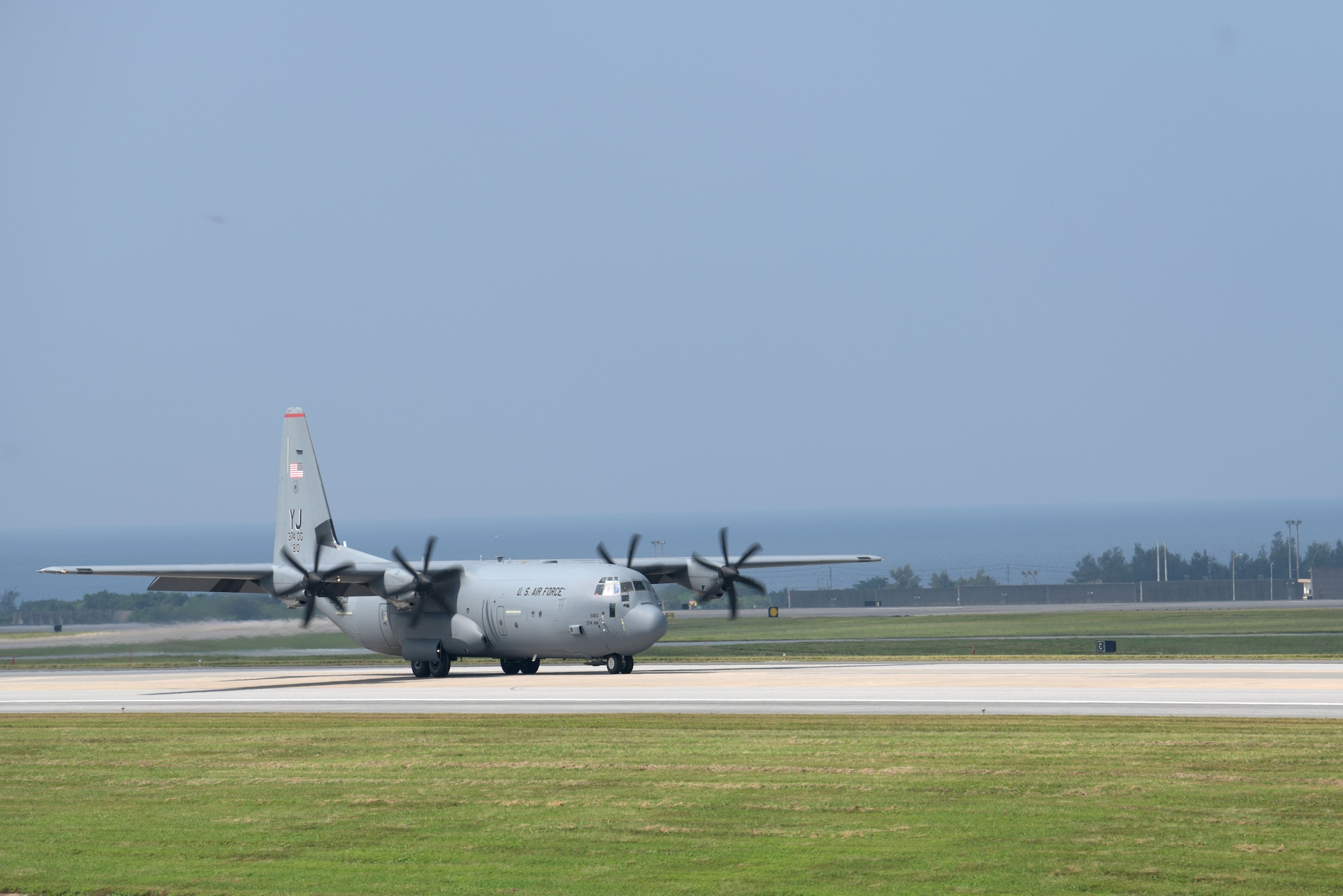 A C-130J Super Hercules from the 374th Airlift Wing, Yokota Air Base, Japan, lands on Kadena Air Base, Japan, for the third iteration of WestPac Rumrunner held Oct. 16, 2020. This exercise is a way to integrate a variety of skills into one training scenario and test interoperability with other services. This is an example of how the military continues to adapt and improve training every day to ensure readiness if ever called upon to defend the vital interests of the U.S. and Japan. (U.S. Air Force photo by Airman 1st Class Rebeckah Medeiros)