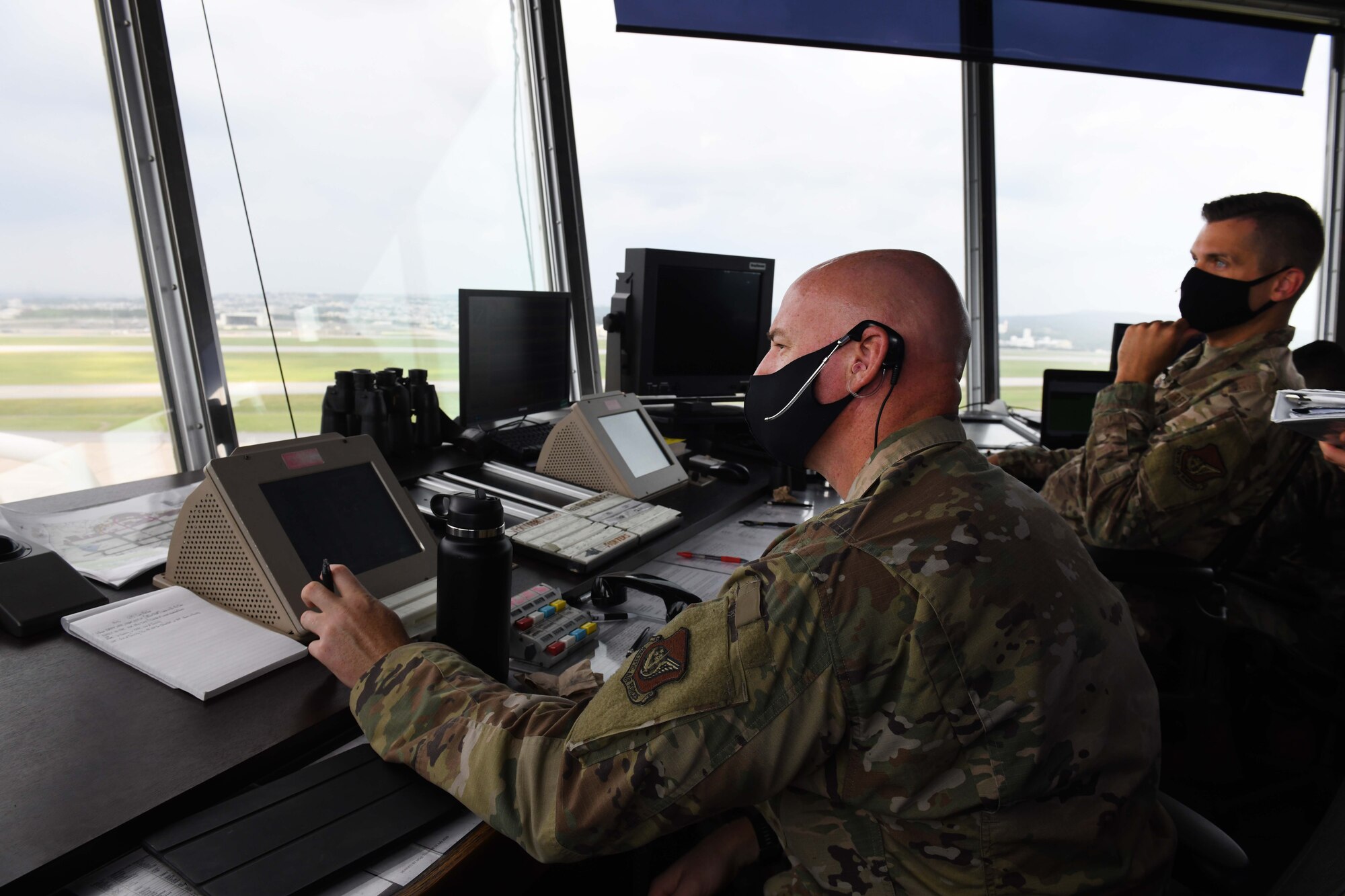 Airmen assigned to the 18th Operations Support Squadron perform air traffic control duties during Exercise WestPac Rumrunner at Kadena Air Base, Japan, Oct. 16, 2020. The 18th Wing executed the third iteration of Exercise WestPac Rumrunner with joint partners with a focus on improved interoperability and fine-tuning of agile combat employment concepts. ACE is the cornerstone of the wing’s operating concept. It enables forces to operate from locations with varying levels of capacity and support, ensuring multi-capable Airmen are postured in a position of advantage to generate combat power. (U.S. Air Force photo by Staff Sgt. Kristan Campbell)