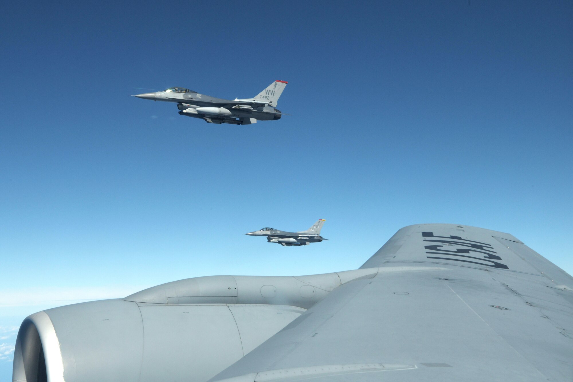 Two U.S. Air Force F-16 Fighting Falcons fly beside a KC-135 Stratotanker from the 909th Air Refueling Squadron, waiting to be refueled during Exercise WestPac Rumrunner, Oct. 16, 2020, out of Kadena Air Base, Japan. The National Defense Strategy directs the armed forces to be more lethal, enhance relationships with allies and partners, and encourage institutional reform. The 18th Wing is employing this directive by developing and continuing new training exercises like WestPac Rumrunner. This exercise represents an evolution in training to adapt to the environment of great power competition. (U.S. Air Force photo by Airman 1st Class Rebeckah Medeiros)