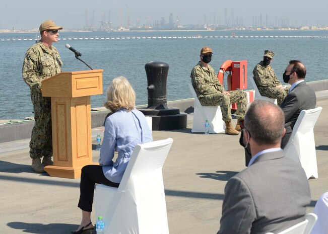 MANAMA, Bahrain (Oct. 21, 2020) Capt. Greg Smith, commanding officer, Naval Support Activity (NSA) Bahrain, speaks during a ribbon cutting ceremony celebrating the installation of the coalition maritime forces waterfront security barrier at the Mina Salman Pier on board NSA Bahrain. The barrier is the first water-limited obstacle system security barrier system ever installed at an overseas naval installation, and the longest waterside security barrier in the U.S. Navy. NSA Bahrain enables the forward operations and responsiveness of U.S. and allied forces in support of Navy Region Europe, Africa, Central’s mission to provide services to the fleet, warfighter and family. (U.S. Navy photo by Mass Communication Specialist 1st Class Justin Yarborough)