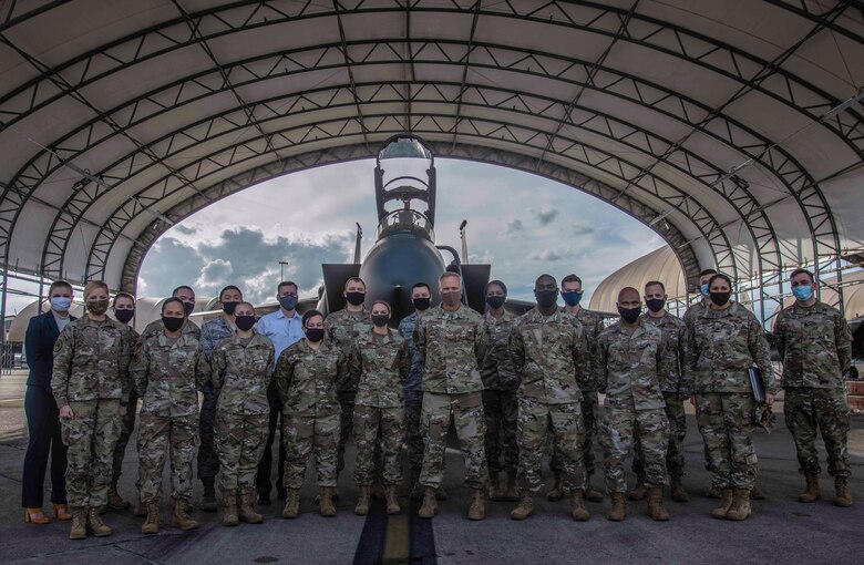 Lt. Gen. Jeffrey Rockwell, Air Force Judge Advocate General, takes a group photo with Airmen assigned to Seymour Johnson Air Force Base, North Carolina, Oct. 20, 2020. Rockwell serves as the Legal Adviser to the Secretary and Chief of Staff of the Air Force, Chief of Space Operations and all officers and agencies of the Department of the Air Force.