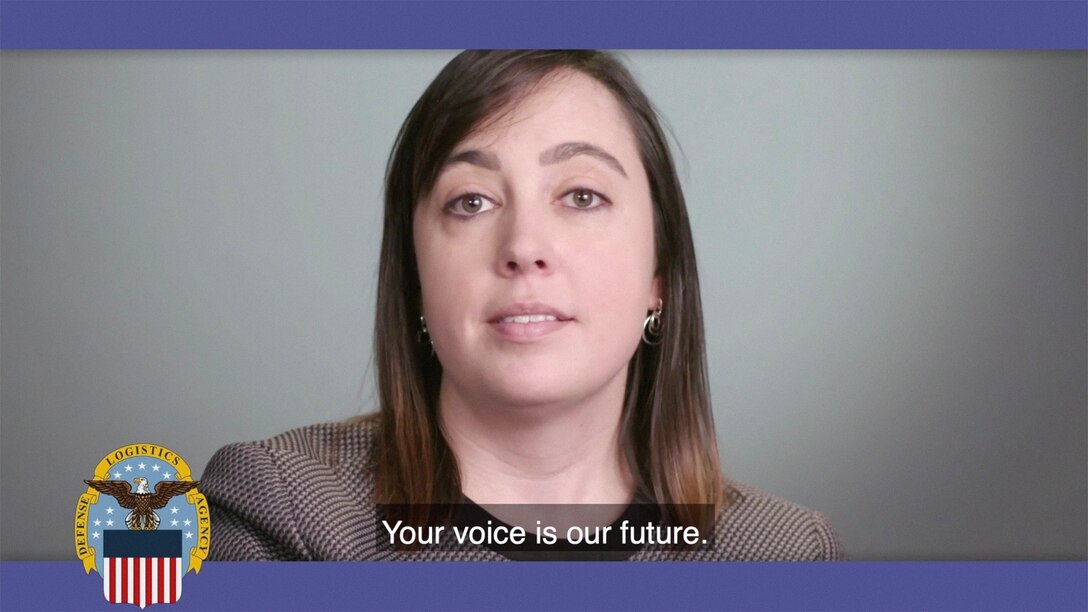 Head and shoulders image showing a white woman with long brown hair with the words "Your voice is our future."