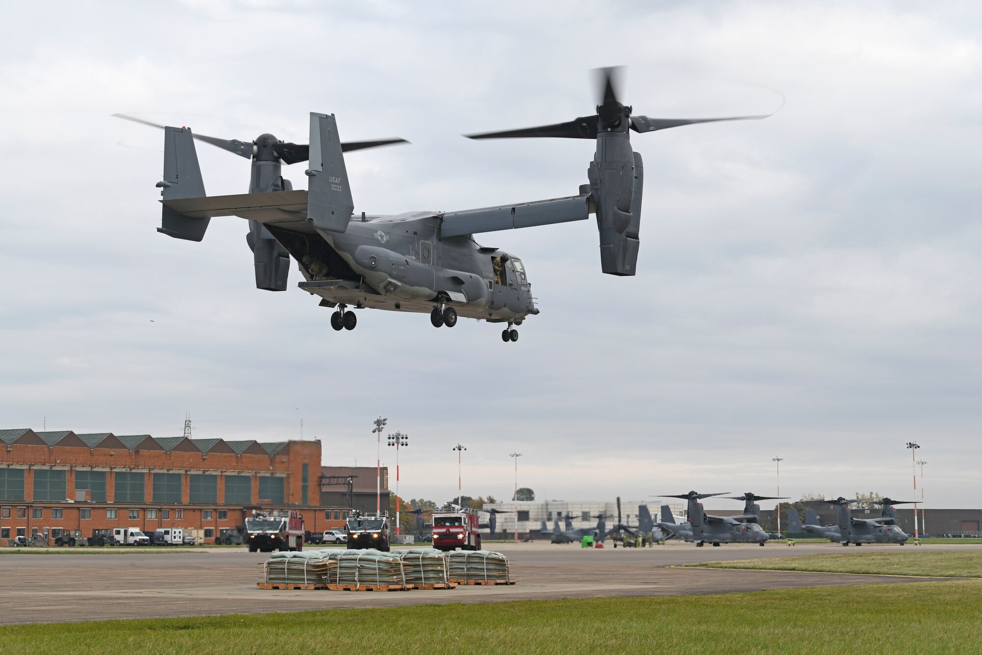 A CV-22 Osprey aircraft assigned to the 352nd Special Operations Wing simulates an emergency landing during training at Royal Air Force Mildenhall, England, Oct. 19, 2020. CV-22 aircrew and 752nd Special Operations Aircraft Maintenance Squadron maintainers conducted the training to enhance readiness and emphasize safety in the event of landing gear malfunctions. (U.S. Air Force photo by Staff Sgt. Mackenzie Mendez)