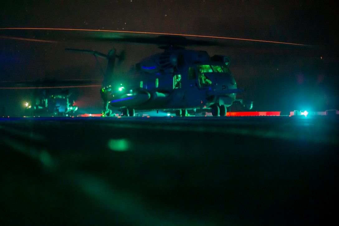 U.S. Marines in a CH-53E Super Stallion prepare for takeoff from the amphibious assault ship USS Makin Island (LHD 8), Oct. 18.