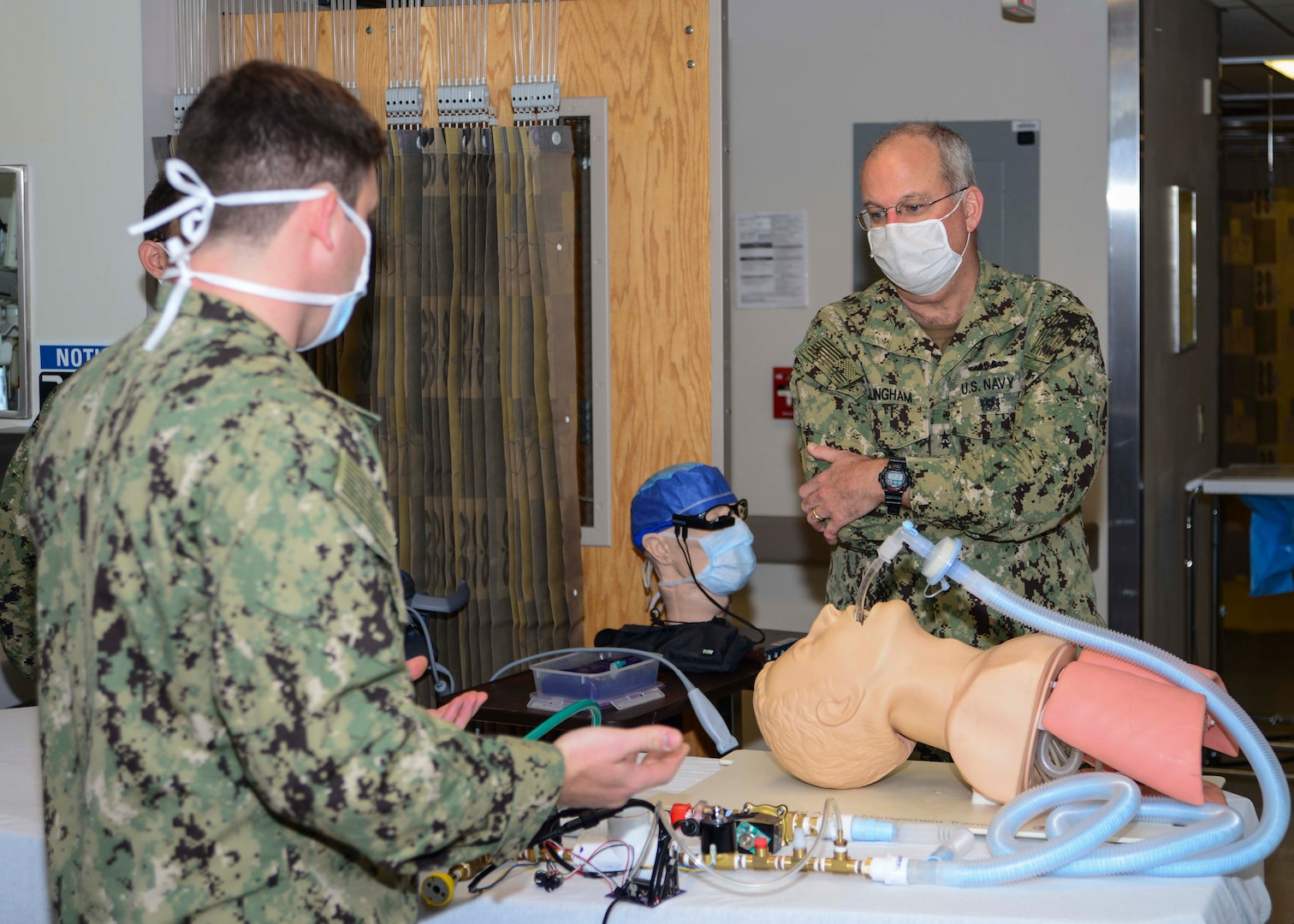 PORTSMOUTH, Va. (Oct. 21, 2020) – Lt. Cmdr. Jacob Cole, left, assistant director of the Anesthesiology Residency Program at Naval Medical Center Portsmouth (NMCP), presents NMCP’s made in-house ventilator to Rear Adm. Bruce Gillingham, surgeon general of the U.S. Navy and chief, of the Bureau of Medicine and Surgery, during his visit of NMCP on Oct. 21.