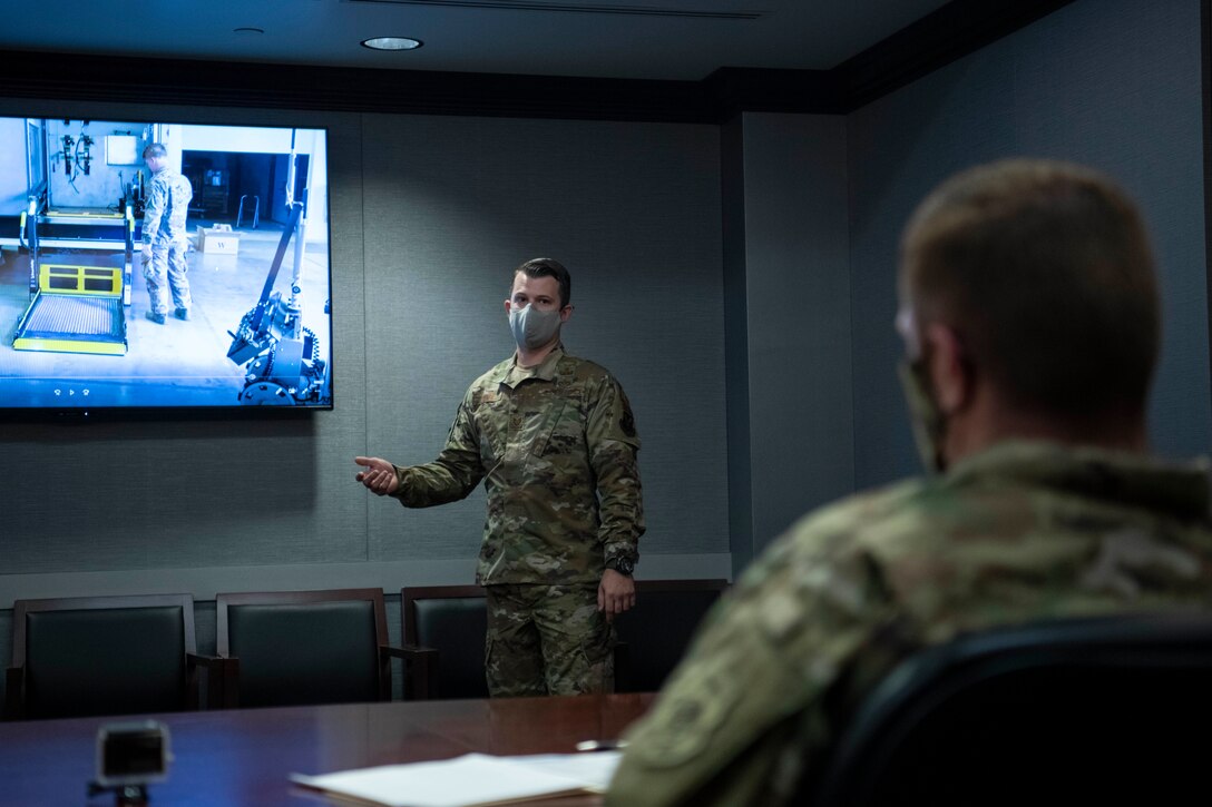 U.S. Air Force Tech. Sgt. Kenneth Dunn, 509th Civil Engineer Squadron Explosive Ordnance Disposal training NCOIC, pitches his teams EOD Rapid Robot Deployment project during a Spark Tank competition, Whiteman Air Force Base, Missouri, Oct. 9, 2020. Whiteman Spark Tank is a competition where Airmen pitch their innovative ideas to a panel of wing and community leadership. Eleven ideas were pitched and the judges selected two to compete at the Air Force Global Strike Command’s Spark Tank competition. (U.S. Air Force photo by Staff Sgt. Dylan Nuckolls)