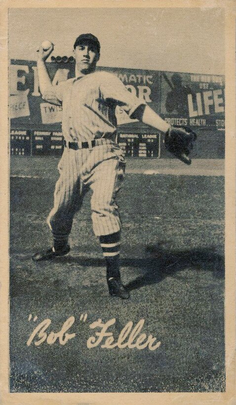 A baseball player pitches a ball.